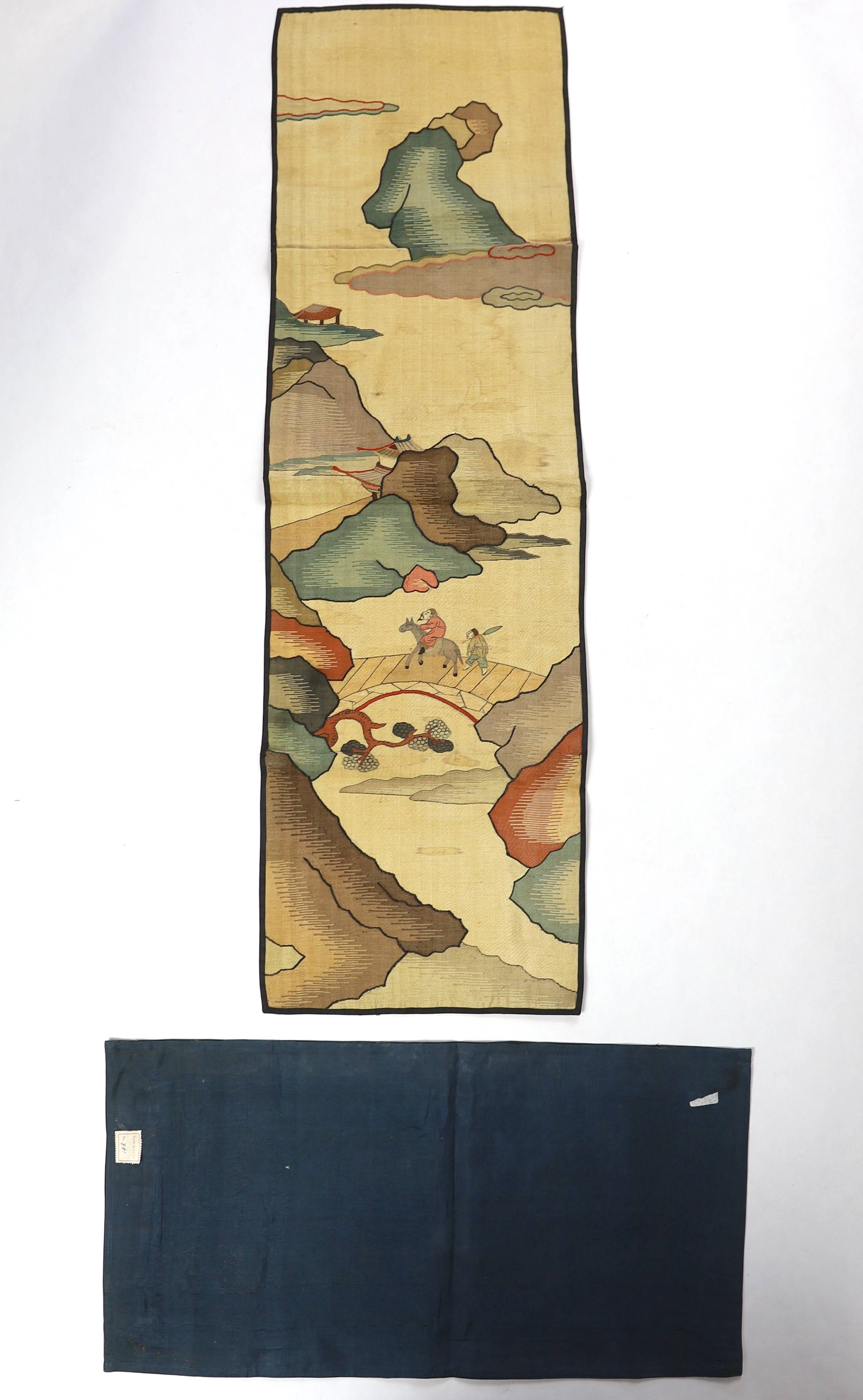 A Chinese late Qing dynasty Kesi polychrome silk hanging, depicting a figure on horseback and another walking within a mountainous landscape, together with a smaller later metallic Kesi panel of stylistic 'lishui waves',